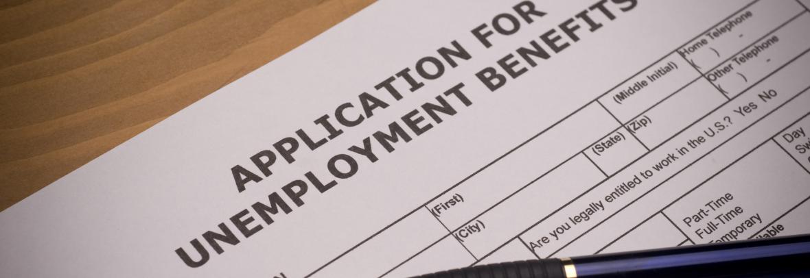 unemployment application and pen